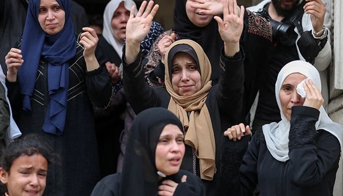 Mourners react during the funeral of Palestinians who were killed in an Israeli strike that took place on Tuesday, according to medics, at Al-Shati camp in Gaza City, April 15, 2026. — Reuters