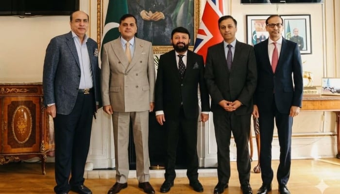 Pakistan High Commission in London and Gerrys Visa Services officials posing for photo after MoU signing. —Facebook@gerrysgroup