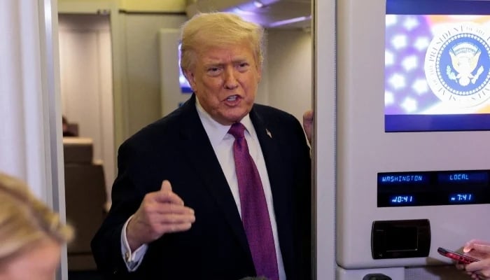 US President Donald Trump talks to members of the media aboard Air Force One en route to Joint Base Andrews, Maryland, US, April 17, 2026. — Reuters