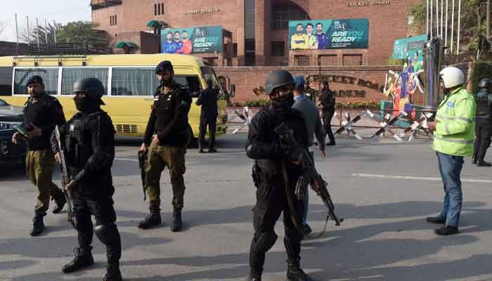 Security personnel stand guard ahead of the start of the Pakistan Super League (PSL) Twenty20 cricket match, outside the Gaddafi Stadium in Lahore. — AFP/File