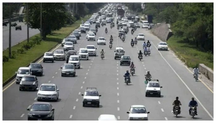 Representational image shows commuters on a road. — AFP/ File