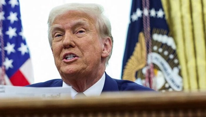 US President Donald Trump sits in the Oval Office of the White House in Washington, DC, US, February 13, 2025. — Reuters