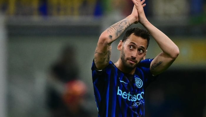 Hakan Calhanoglu can be seen celebrating. —AFP/File