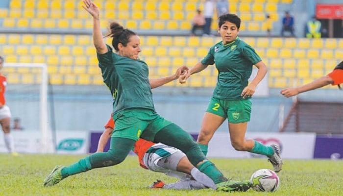 Pakistan captain Maria Jamila Khan vies for the ball during the SAFF Women’s Championship match against Bangladesh at the Dasharath Rangasala Stadium on Saturday.—SAFF