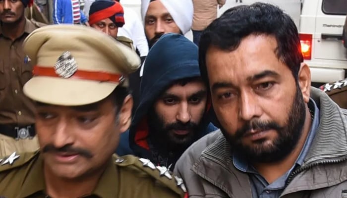 Jagtar being escorted to a court in Ludhiana on 24 November 2017. —AFP/File