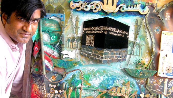 The image shows artist and calligrapher Azeem Iqbal with his artwork, published on Facebook on April 9, 2026. — Facebook@azeem.iqbal.5855