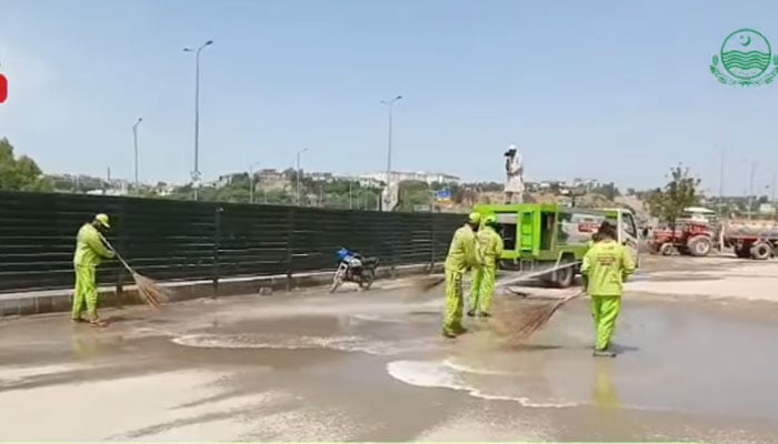 The staff of the Rawalpindi Waste Management Company busy in cleaning work in the city on April 23, 2026. — Facebook@www.rwmc.org.pk/Screengrab