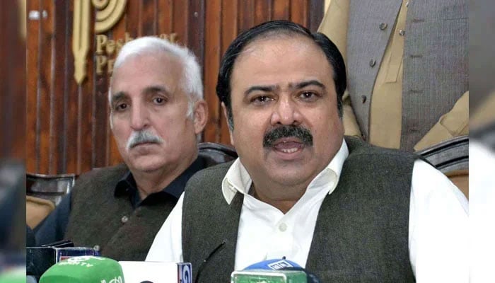 Qaumi Watan Party (QWP) provincial Chairman Sikandar Hayat Khan Sherpao (right) addresses media persons during a press conference at Peshawar press club on November 27, 2024. — PPI