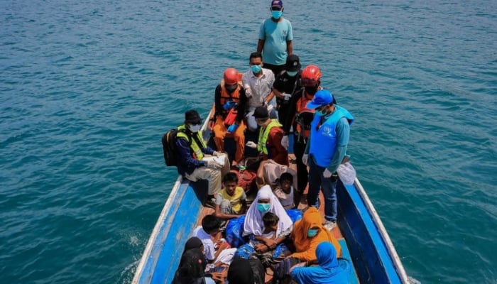 Amanda Jufrian Rohingya refugees are rescued by local authorities and the community in South Aceh, Indonesia, after a perilous journey that claimed lives.—UNHCR/File