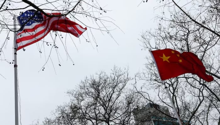 The flags of the United States and China wave in the wind in New York City, US, February 17, 2026.—Reuters