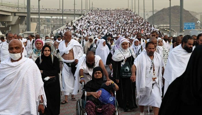Muslim pilgrims arrive to perform the symbolic stoning of the devil ritual as part of the haj pilgrimage in Mina, near Makkah, on June 16, 2024. — AFP