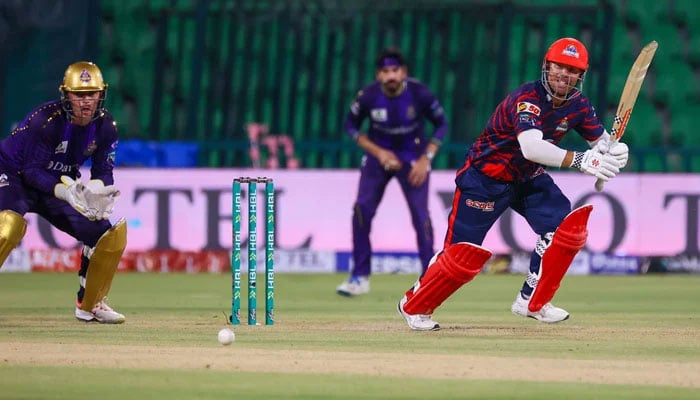 Karachi Kings David Warner watches the ball after playing a shot during their PSL 11 match against Quetta Gladiators at the Gaddafi Stadium in Lahore on March 27, 2026. — PSL