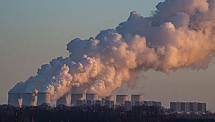 This image shows smoke billowing out into the environment from a power plant. — AFP/File