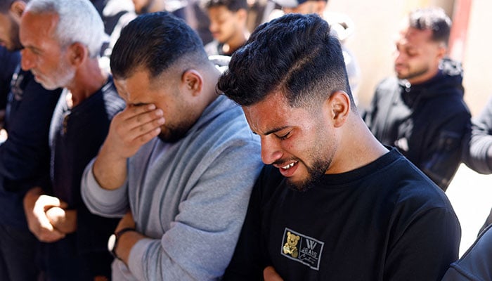 Mourners react during a funeral for Palestinians killed in an Israeli airstrike, according to medics, at Al-Aqsa Martyrs Hospital in Deir al-Balah, central Gaza Strip, April 23, 2026. — Reuters