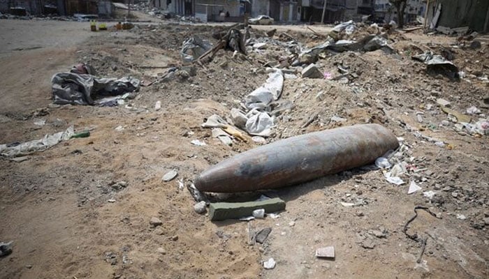 An unexploded missile fired by an Israeli aircraft lies among the rubble, amid the ongoing conflict between Israel and Hamas, in the northern Gaza Strip May 14, 2024. — Reuters