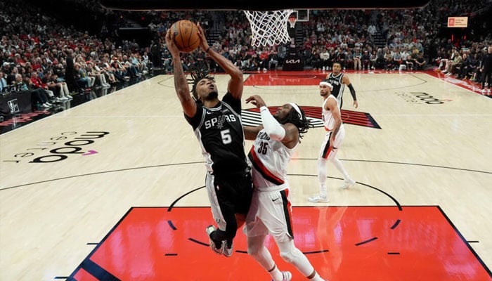 Stephon Castle of the San Antonio Spurs attempts a layup in the Spurs victory over the Portland Trail Blazers in game three of their NBA playoff series. —AFP