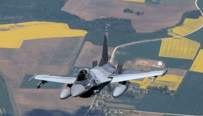 A Romanian Air Force F-16s military fighter jet participates in NATOs Baltic Air Policing Mission in Lithuanian airspace near Siauliai, Lithuania, on May 23, 2023.—AFP