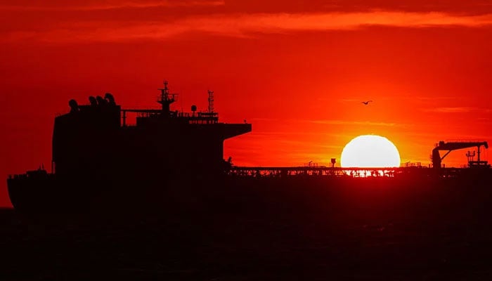 An oil tanker anchors near the oil hub of the port of Fos-Lavera at sunset near Marseille, southern France, April 14, 2026. — Reuters