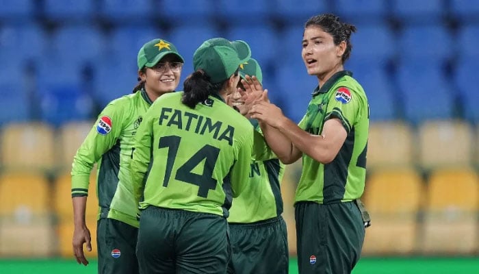 Rameem Shamim of Pakistan (left) celebrates with team mates Fatima Sana (centre) and Diana Baig (right) after running out Annerie Dercksen (not pictured) during the ICC Womens Cricket World Cup 2025 match against South Africa at R. Premadasa Stadium on October 21, 2025 in Colombo, Sri Lanka. — ICC