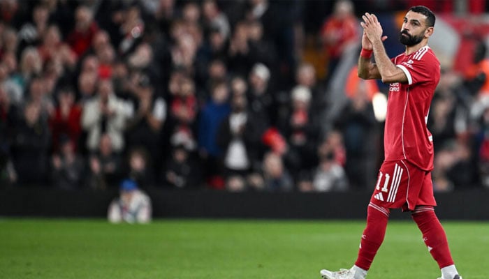 Mohamed Salah applauds as he leaves the pitch after being substituted during Liverpools Champions League match against Galatasaray. —AFP