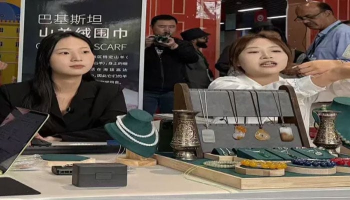 Chinese live streamers boost Pakistani products at the National Pavilion in Wuhan. —APP/File