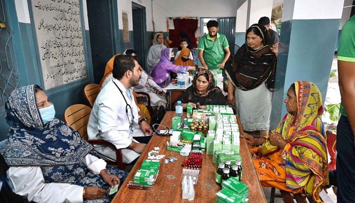 This representational image shows doctors examining patients at a medical camp at Farrukhabad, the Provincial Capital, on September 1, 2025. — APP