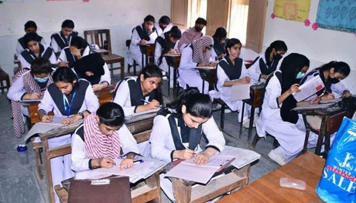This representational image shows female students solving their examination papers at a government college. — APP/File