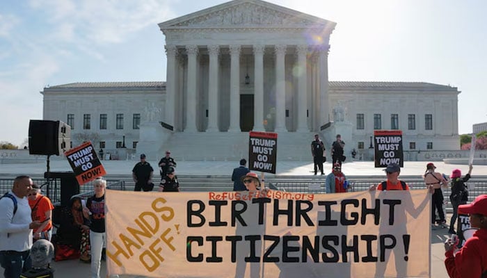 Demonstrators hold signs outside the US Supreme Court building on the day the court is expected to hear oral arguments on the legality of the Trump administration’s effort to limit birthright citizenship for the children of immigrants, in Washington, DC, US, April 1, 2026. — Reuters