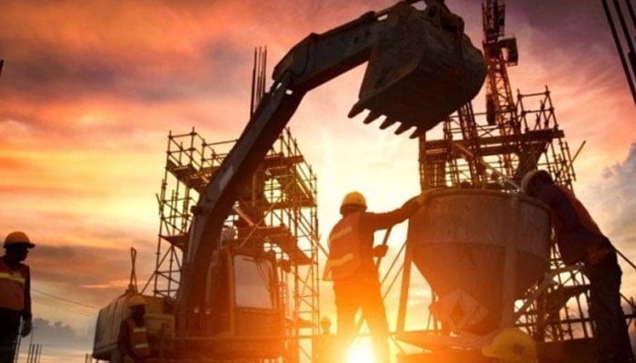 This representational image shows two labourers working on a development project. — Reuters/File