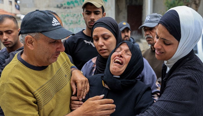 Mourners attend the funeral of Palestinians who were killed by Israeli gunfire and tank shelling, according to medics, in Gaza City, April 26, 2026. — Reuters