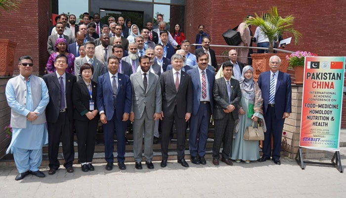 Federal Health Minister Syed Mustafa Kamal is seen in a group photo after the Pakistan-China International Conference on Food-Medicine Homology, Nutrition and Health, inaugurated at Shaheed Zulfiqar Ali Bhutto Institute of Science and Technology (SZABIST) Islamabadon April 27, 2026. — Facebook@OIC.Comstech