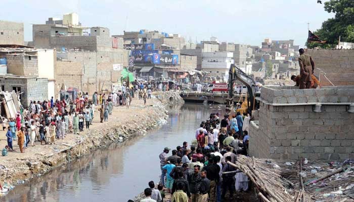 Heavy machinery busy in demolishing encroachments established along the Gujjar Nullah during anti-encroachment campaign under the supervision of Karachi Municipal Corporation (KMC), located on Cafe Pyala Gulberg area of Karachi on Wednesday, September 2, 2020. —  PPI