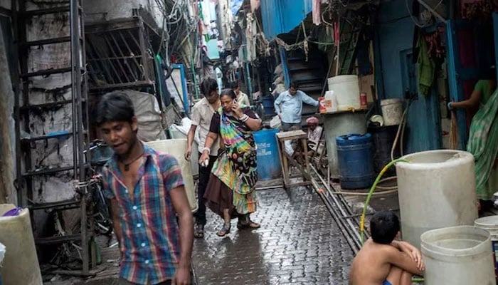 Residents walk in an alley in Dharavi, one of Asias largest slums, in Mumbai March 12, 2015.—Reuters