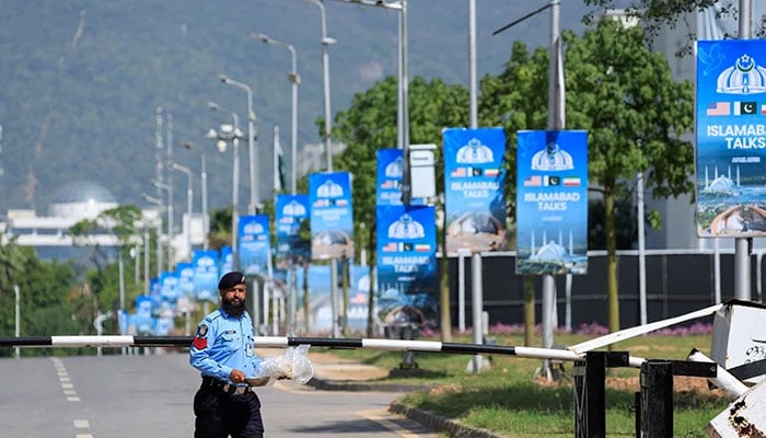 A police officer walks on the premises of the Serena Hotel in Islamabad, April 21, 2026. — Reuters