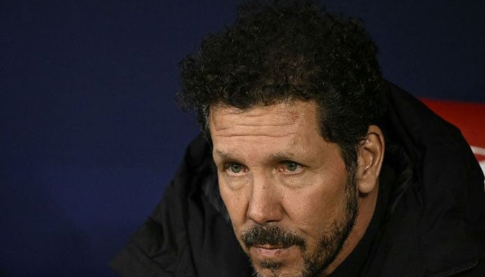 Atletico Madrids Argentinian coach Diego Simeone sits on the bench during the Spanish Copa del Rey (Kings Cup) semi final first leg football match between Club Atletico de Madrid and Athletic Club Bilbao at the Metropolitano stadium in Madrid on February 7, 2024.— AFP