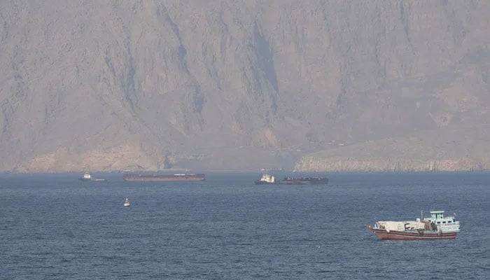 Ships and tankers in the Strait of Hormuz off the coast of Musandam, Oman, April 18, 2026. — Reuters
