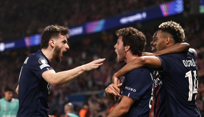 Khvicha Kvaratskhelia (left) celebrating with teammates. — AFP