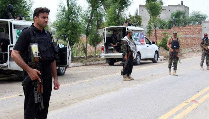 Security personnel stand guard outside FC checkpost in KPs Bannu. — The News/ Manzoor uddin/File
