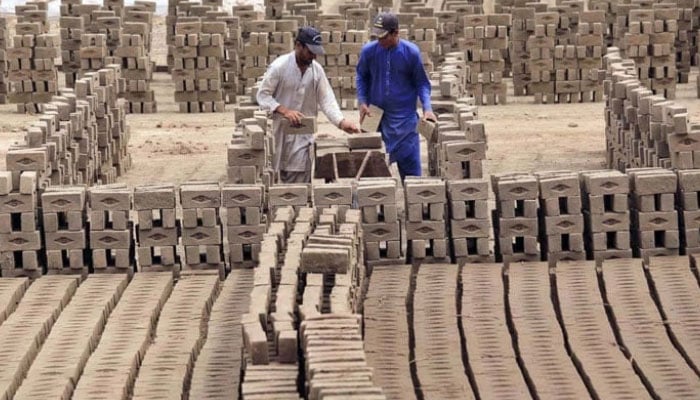 Labourers are busy in their work at brick kilns, as International Labour Day is celebrated on May 1 every year on May 1, 2024. — APP