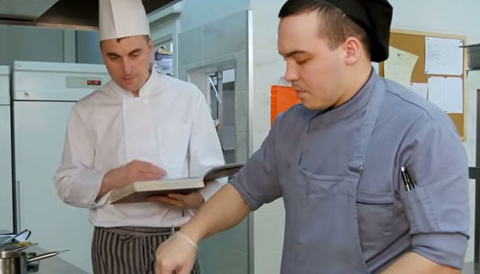 This image shows two people in a commercial kitchen setting in the ILO video. — ILO website/Screengrab