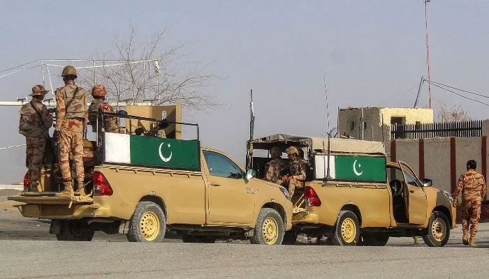 Pakistani soldiers patrol near the Pakistan-Afghanistan border crossing in Chaman on February 27, 2026, following overnight cross-border fighting between the two countries. — AFP