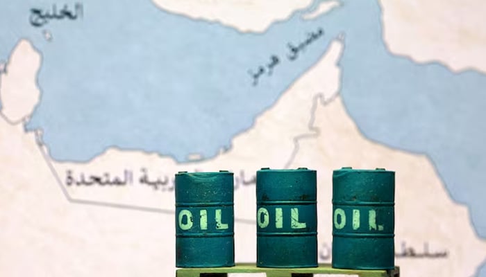 A map showing the Strait of Hormuz, also known as Madiq Hurmuz, and 3D printed oil barrels are seen in this illustration taken March 26, 2026. — Reuters