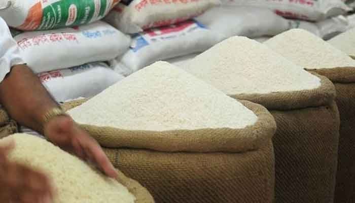 This picture shows a shopkeeper selling basmati rice. — AFP/File