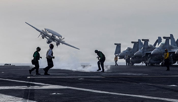 An E-2D Hawkeye surveillance aircraft launches from the flight deck of the US Navy Nimitz-class aircraft carrier USS Abraham Lincoln during thge Operation Epic Fury attack on Iran March 31, 2026. — Reuters
