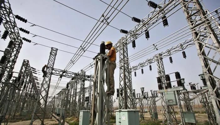 A representational image of a grid station where an electrician is busy working in Hyderabad. — APP/File
