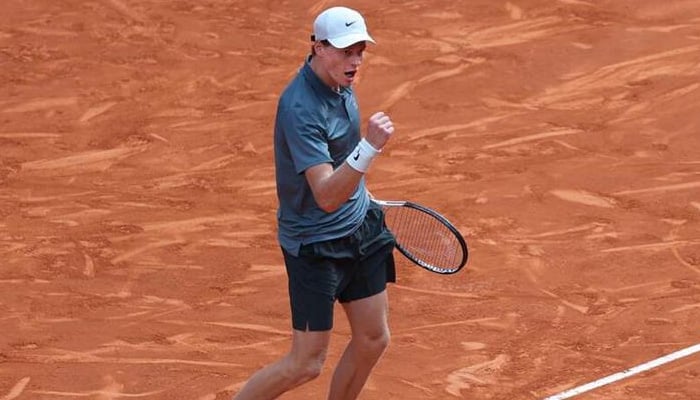 Italys Jannik Sinner celebrates beating Frances Arthur Fils during their 2026 ATP Tour Madrid Open tennis tournament semi-final singles match at the Caja Magica in Madrid, on May 1, 2026. — AFP