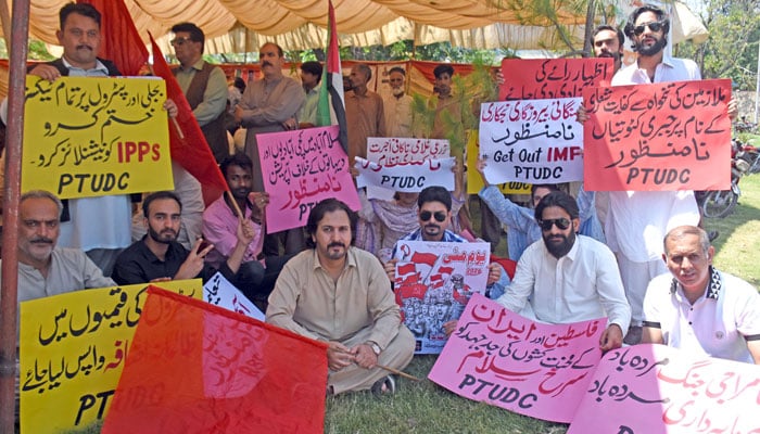 Activists of Pakistan Trade Union Defence Campaign (PTUDC) hold placards during a protest in favour of their demands on the eve of International Labour Day, in Islamabad, on May 1, 2026. — ONLINE