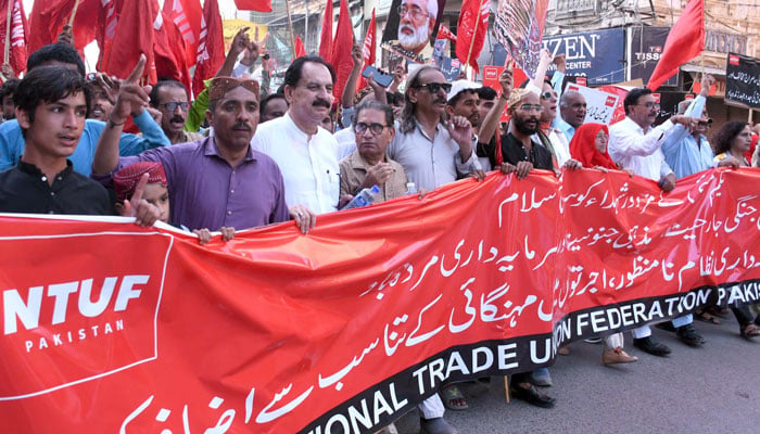 Activists of the National Trade Union Federation (NTUF) hold placards and banner during a protest rally on May Day, also known as International Workers Day, in Karachi, on May 1, 2026. — ONLINE