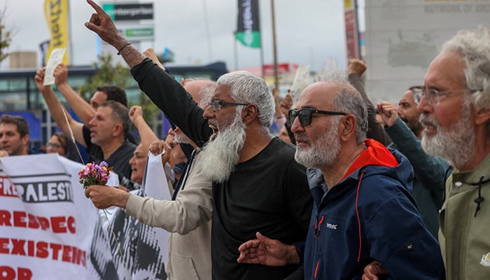 Activists from the Global Sumud Flotilla, which was intercepted on international waters by the Israeli Navy, and supporters shout slogans outside the airport of Heraklion, on the island of Crete, Greece, May 1, 2026. — Reuters