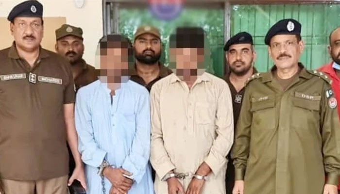 The representational image shows arrested suspects stand handcuffed with the Punjab police personnel. — The News/File